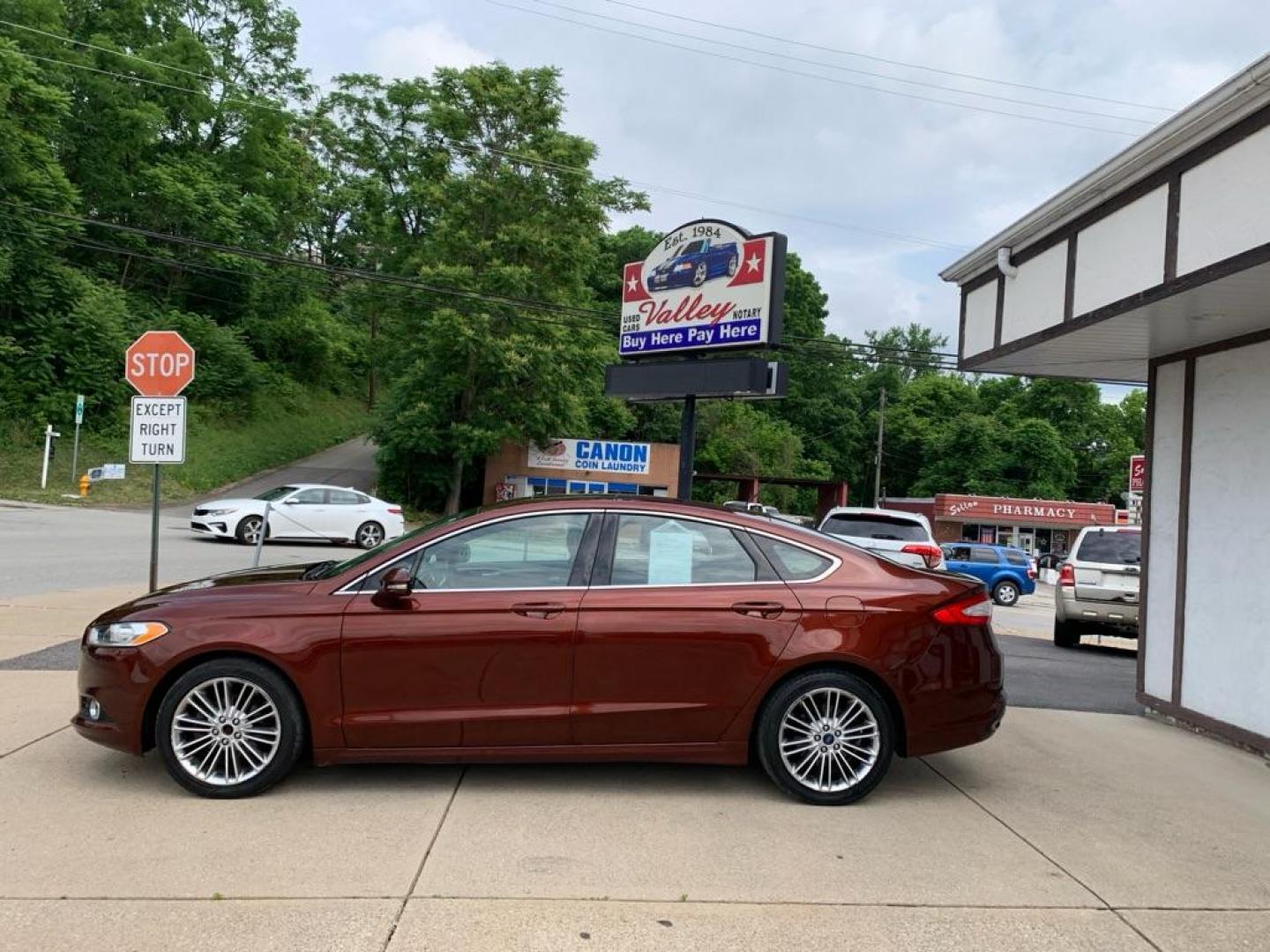 2015 MAROON FORD FUSION SE (3FA6P0T99FR) with an 2.0L engine, Automatic transmission, located at 503 First Street, Canonsburg, PA, 15317, (724) 745-0566, 40.266006, -80.178413 - Photo#1