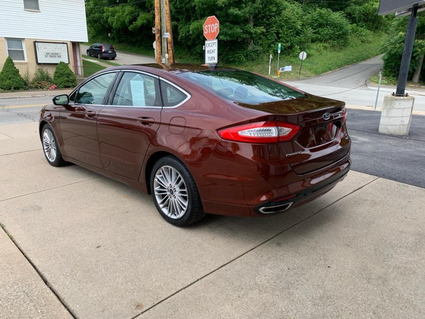 2015 MAROON FORD FUSION SE (3FA6P0T99FR) with an 2.0L engine, Automatic transmission, located at 503 First Street, Canonsburg, PA, 15317, (724) 745-0566, 40.266006, -80.178413 - Photo#2