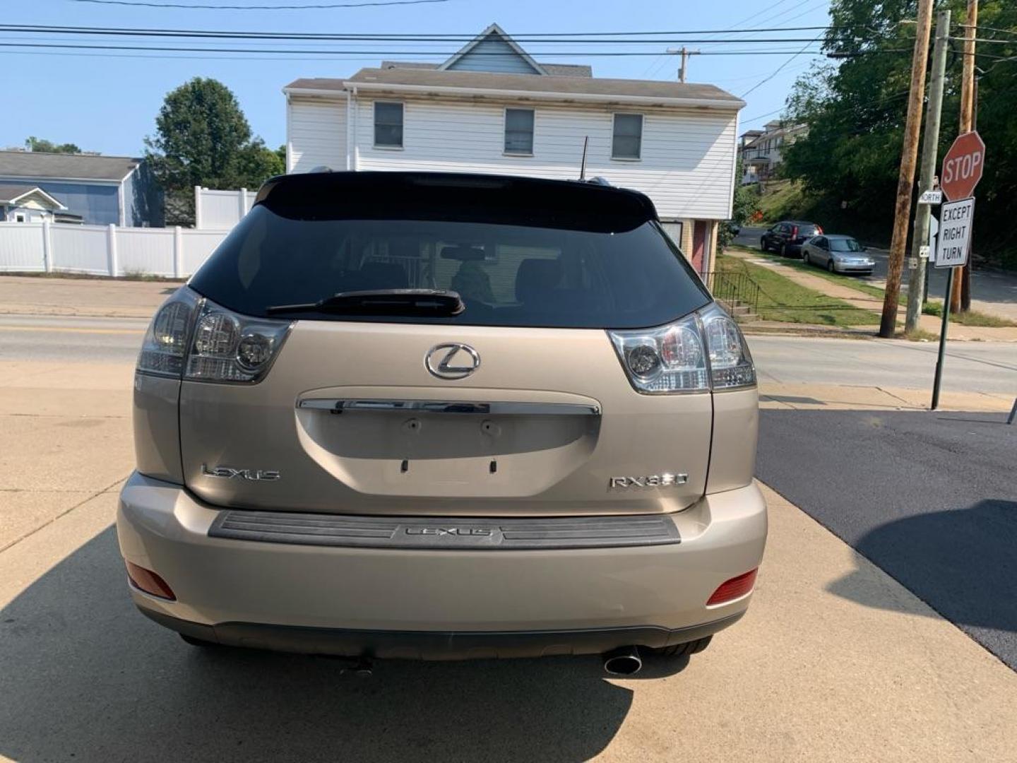 2008 GOLD LEXUS RX 350 (2T2HK31U58C) with an 3.5L engine, Automatic transmission, located at 503 First Street, Canonsburg, PA, 15317, (724) 745-0566, 40.266006, -80.178413 - THIS VEHICLE IS BEING SOLD UNDER CONSIGNMENT! CAR FAX AVAILABLE! NAVIGATION, BACK UP CAMERA, SUNROOF, AM/FM/SAT/TAPE/6 DISC CD CHANGER WITH TOUCH SCREEN DISPLAY, SUNROOF, HEATED SEATS WITH MEMORY, HANDS FREE VOICE ACTIVATION, RADIO CONTROLS ON STEERING WHEEL, UNIVERSAL GARAGE DOOR OPENER, CRUISE - Photo#3