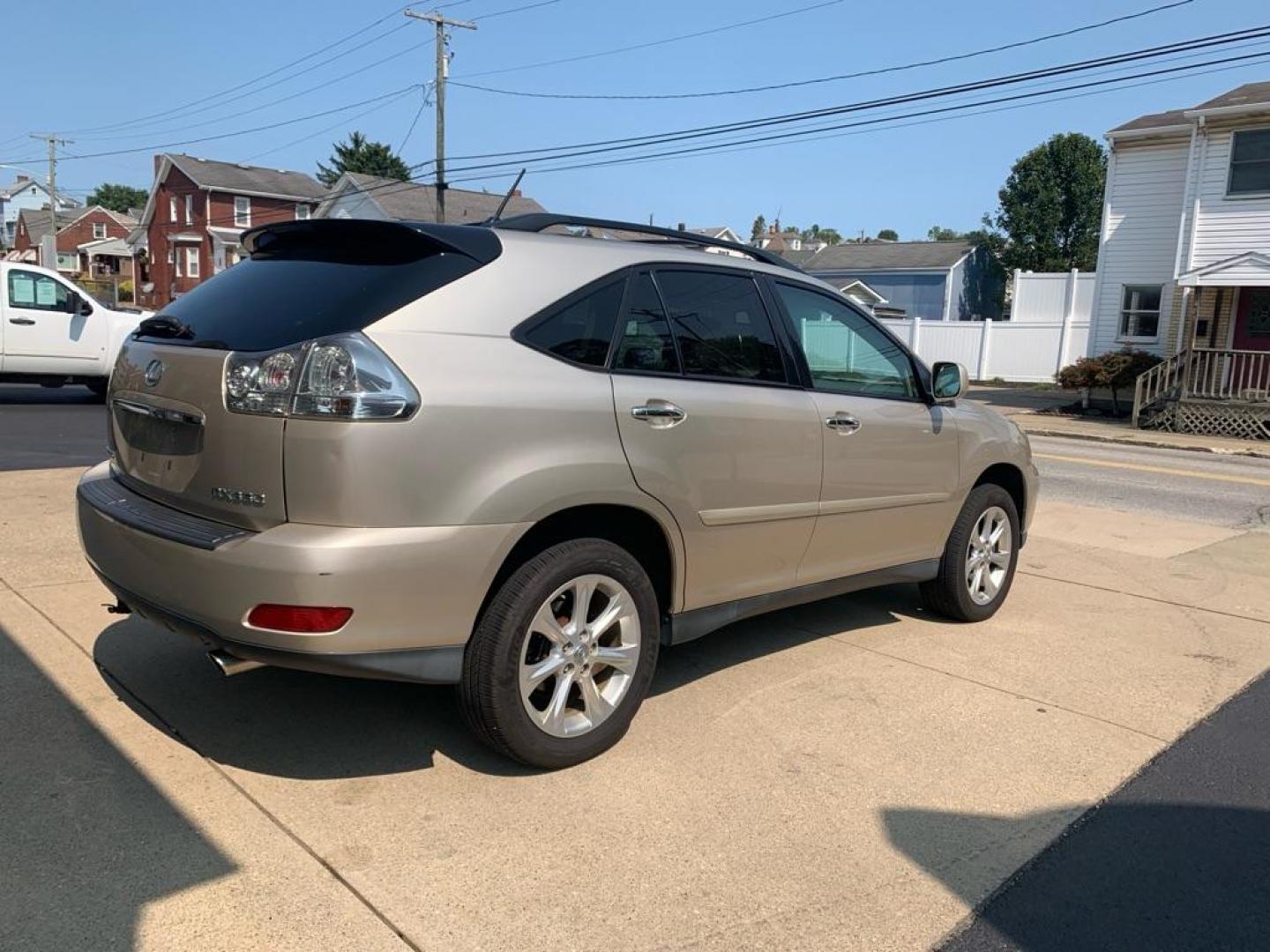 2008 GOLD LEXUS RX 350 (2T2HK31U58C) with an 3.5L engine, Automatic transmission, located at 503 First Street, Canonsburg, PA, 15317, (724) 745-0566, 40.266006, -80.178413 - THIS VEHICLE IS BEING SOLD UNDER CONSIGNMENT! CAR FAX AVAILABLE! NAVIGATION, BACK UP CAMERA, SUNROOF, AM/FM/SAT/TAPE/6 DISC CD CHANGER WITH TOUCH SCREEN DISPLAY, SUNROOF, HEATED SEATS WITH MEMORY, HANDS FREE VOICE ACTIVATION, RADIO CONTROLS ON STEERING WHEEL, UNIVERSAL GARAGE DOOR OPENER, CRUISE - Photo#4