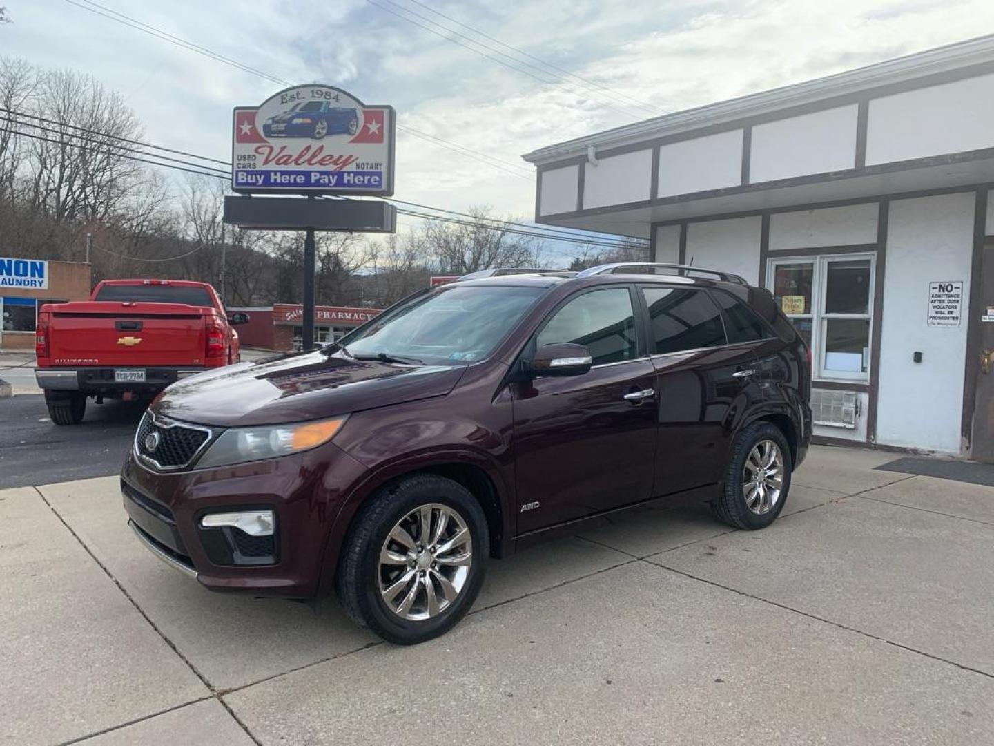 2012 MAROON KIA SORENTO SX (5XYKWDA27CG) with an 3.5L engine, Automatic transmission, located at 503 First Street, Canonsburg, PA, 15317, (724) 745-0566, 40.266006, -80.178413 - Photo#0